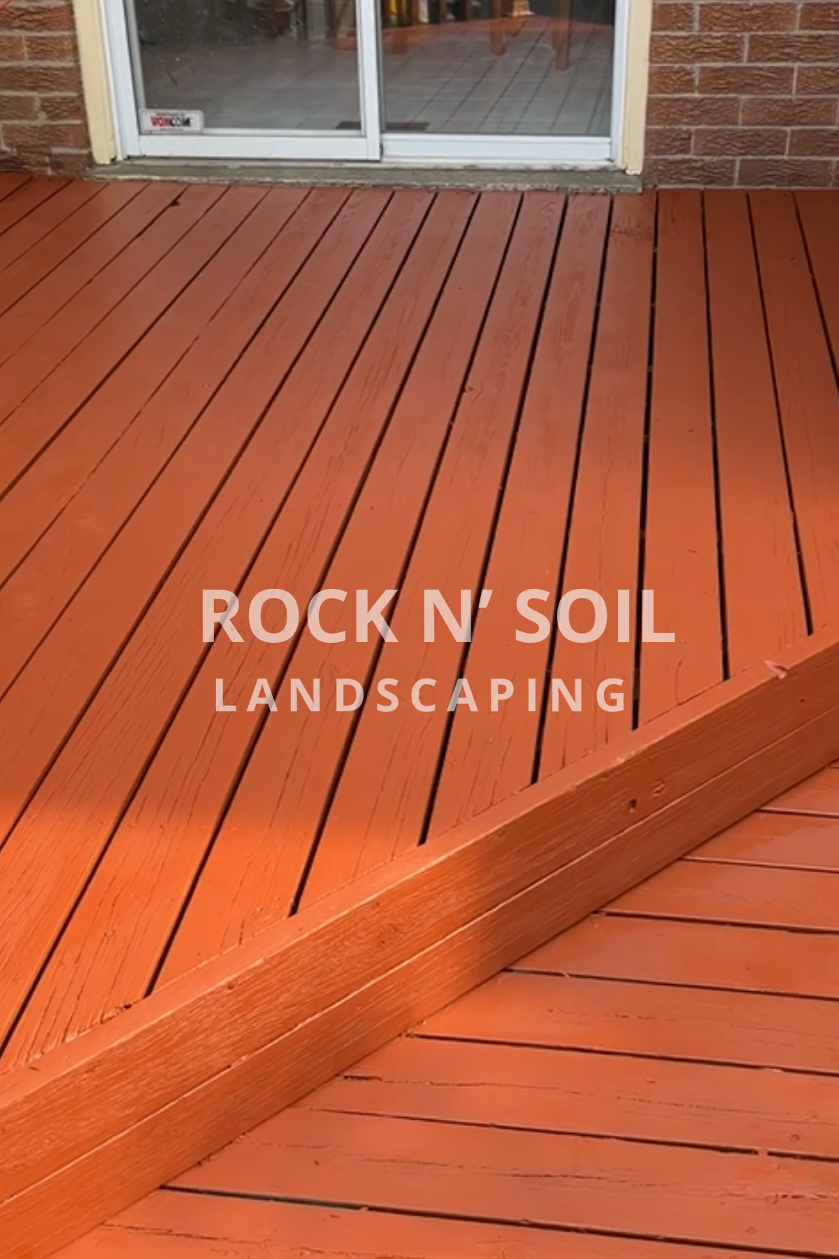 before and after photos, this is the after photo of a deck after it was sanded and stained, looking just like new.